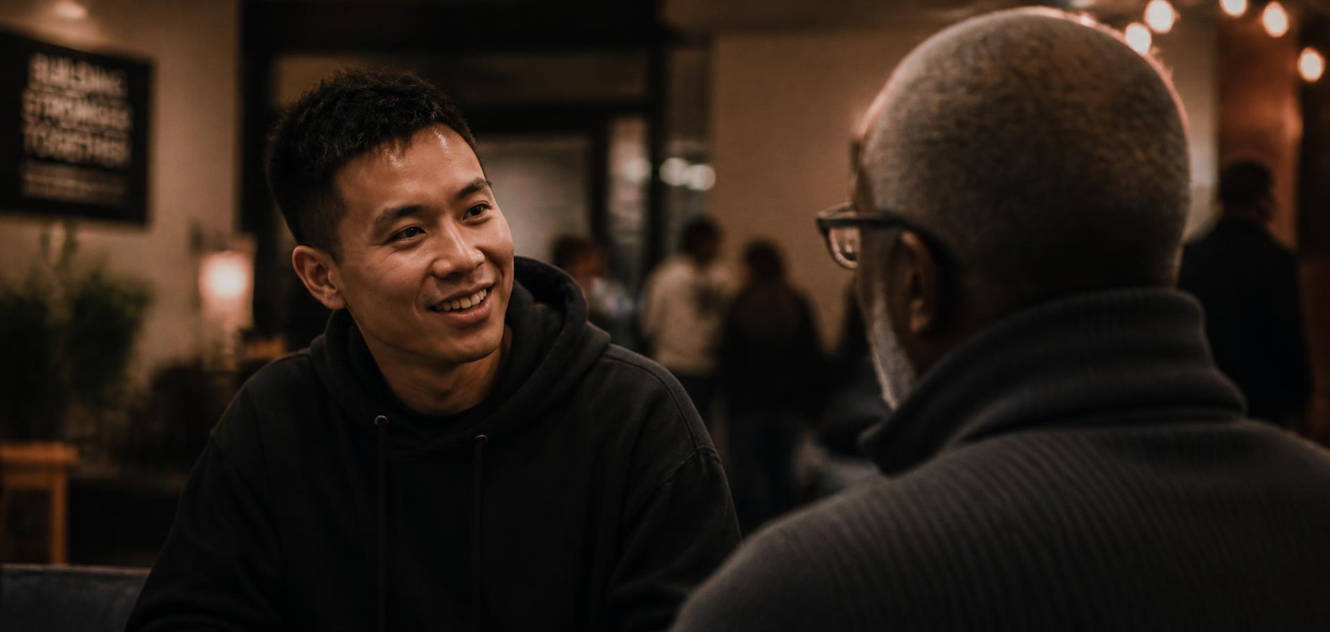 Two people in warm conversation in a community space